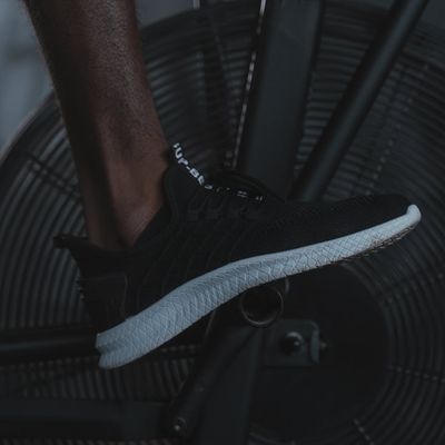 Close-up of a person's feet in motion during a workout.